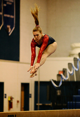 Jefferson senior Hailey Johnson jumps during her beam routine at a gymnastics meet at West Potomac High School on January 3, 2011.