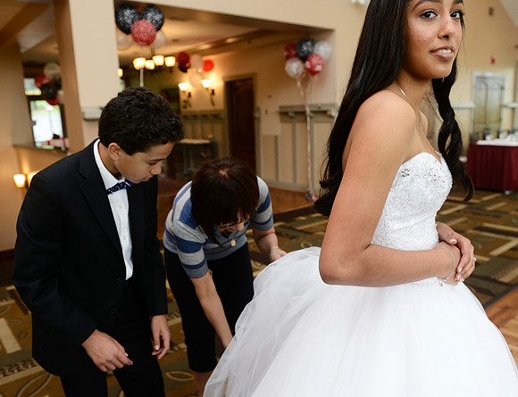Adjusting the dress is a complicated affair.