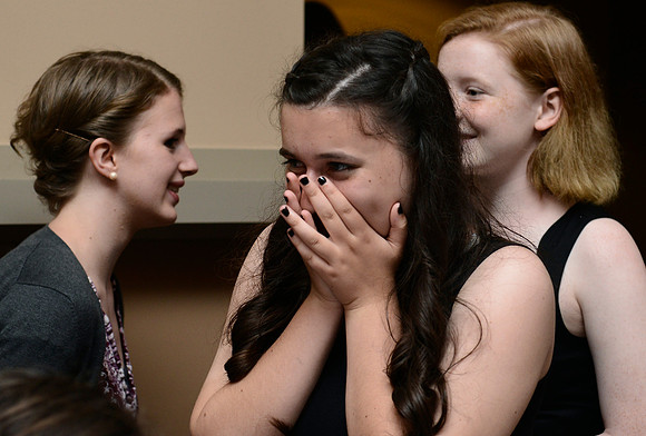 Alex's friend expresses her joy at seeing Alex in her dress.