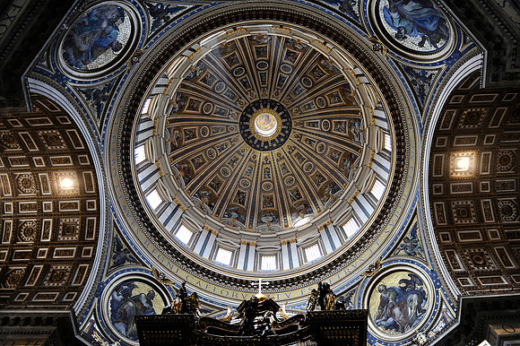 A view up at the main dome in St. Peter's Basilica in the Vatican City. The top of the baldacchino, designed by Bernini, is visible at the bottom.July 3, 2012