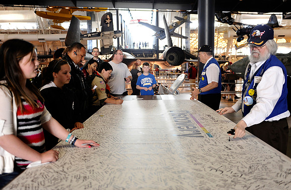 Visitors to the Steven F. Udvar-Hazy Center were encouraged to sign a banner for the space shuttle Discovery's induction on April 19, 2012.