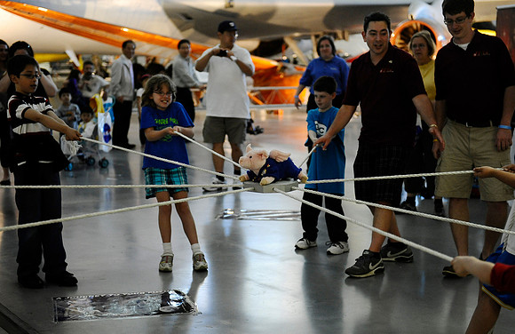 Instructors used a cooperative exercise to teach children about teamwork during "Welcome Discovery" celebrations at the Steven F. Udvar-Hazy Center on April 19, 2012. The goal was to move the plush pi