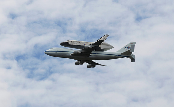The space shuttle Discovery flies over Washington, DC on its final flight on April 17, 2012.
