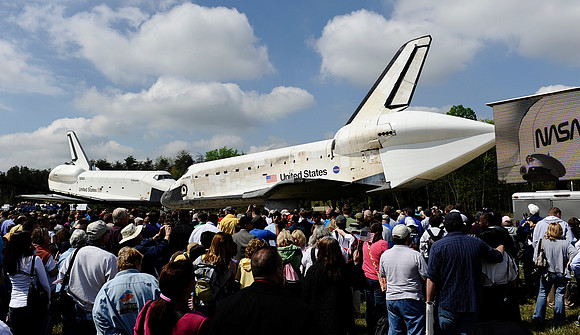 Space shuttles Enterprise (left) and Discovery on display during a ceremony to transfer ownership of Discovery to the Smithsonian's Steven F. Udvar-Hazy Center on April 19, 2012. The Discovery takes t